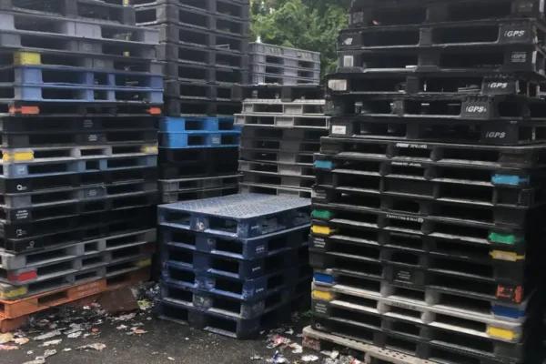 Plastic pallets being recycled through packaging waste recycling services